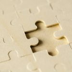 Macro shot jigsaw puzzle missing solution concept